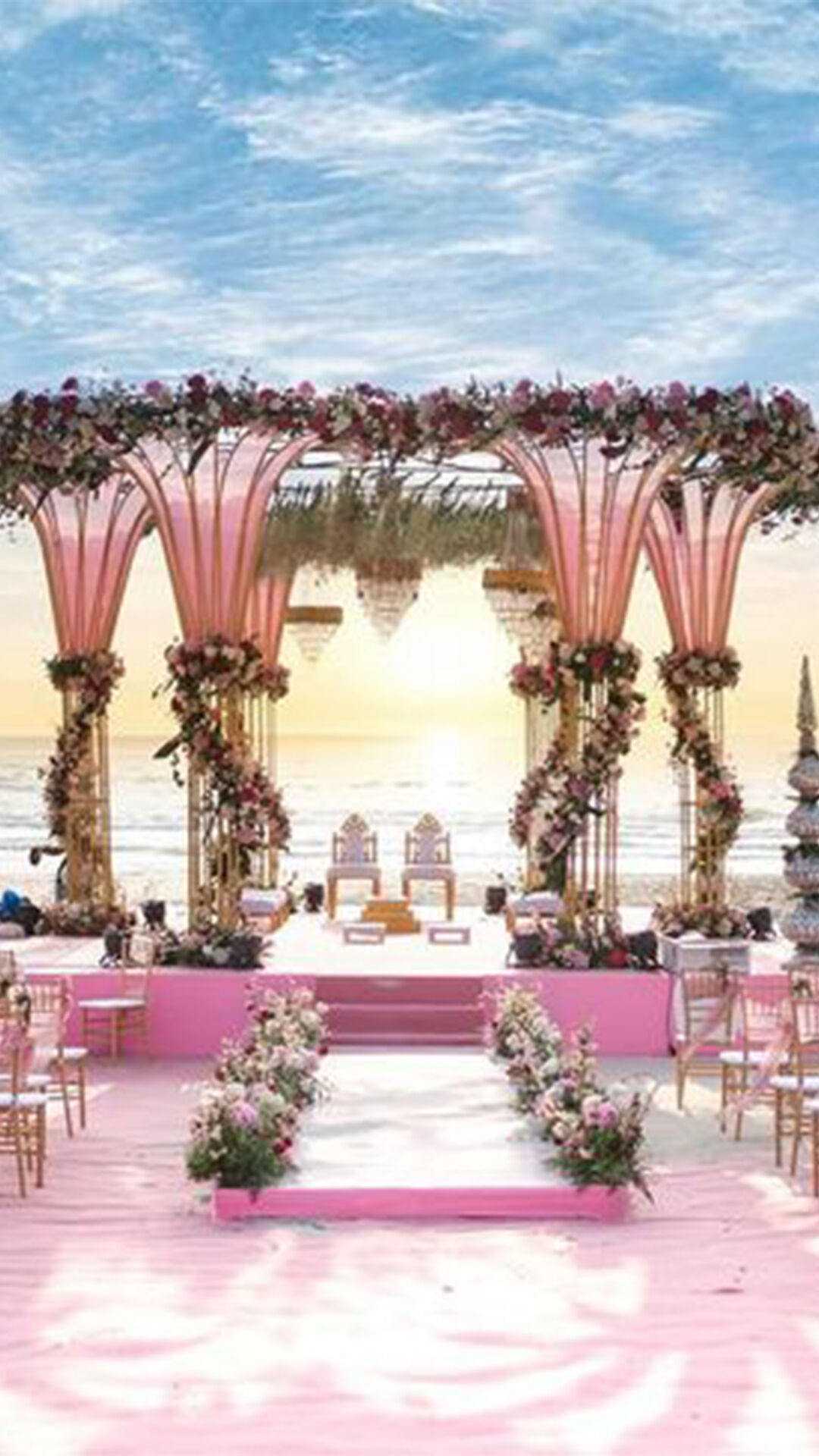 Enchanting bridal entry setup adorned with flower pots on both sides for a dreamy wedding entrance.